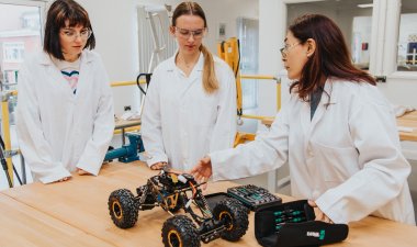 female students with remote engineered car