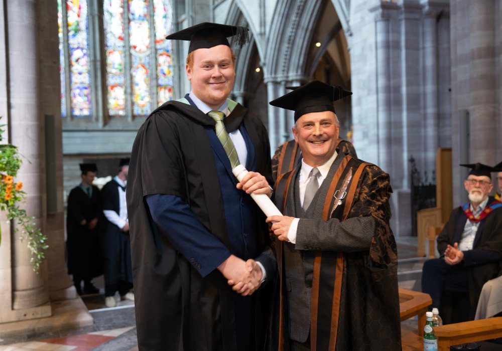 James Newby and NMITE graduate shaking hands