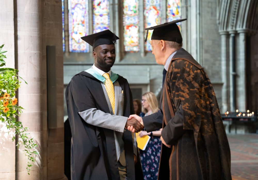 James Newby and NMITE graduate shaking hands