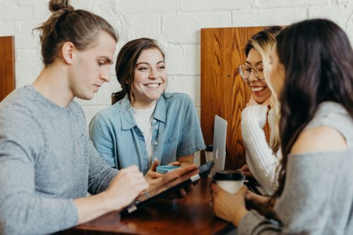 International students talking around a table