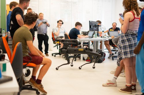 NMITE Students in a studio with a robotic dog from oxford dynamics