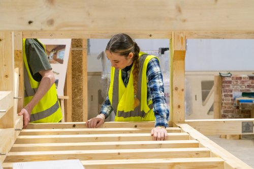 A student working with timber at an NMITE Open Day