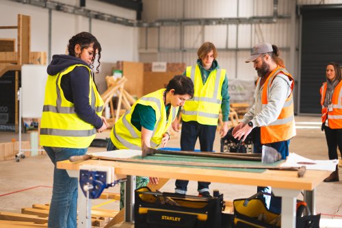 A group of people looking at a construction project