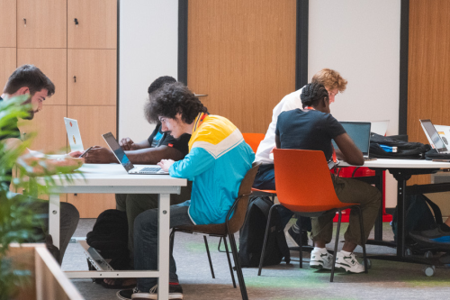 A group of students at desks studying