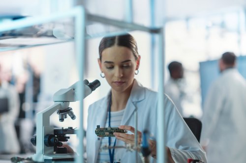 Women working in Radio Frequencies wearing a lab coat 