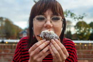 NMITE student eating a donut