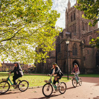 Hereford Cathedral and NMITE students riding Beryl bikes