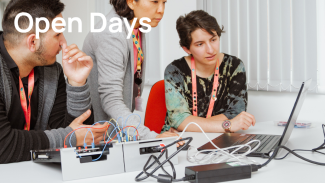 Book an engineering degree open day at NMITE. Image shows students working on electronics with an NMITE professor