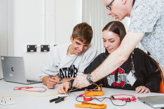 NMITE students and staff working on an electrical engineering project