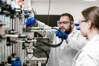 Students in lab coats doing factory practical