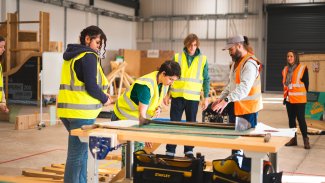 Men and women in construction and engineering conversation