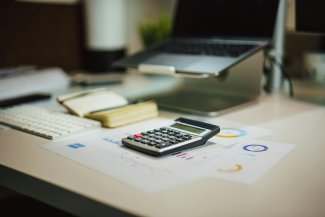 Image of a calculator on a desk