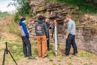 students doing coursework at castle