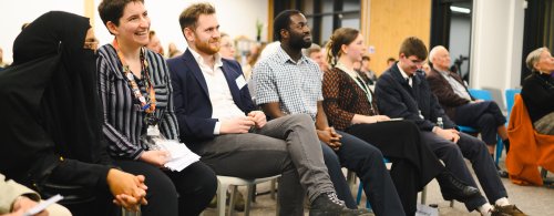 People on seats at showcase event