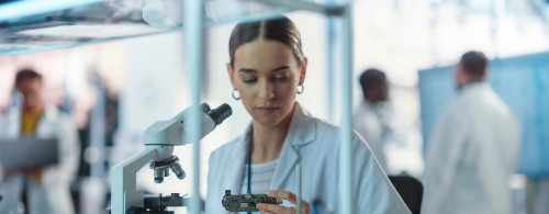 Women working in Radio Frequencies wearing a lab coat 